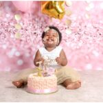 First birthday cake smash milestone with baby Joy